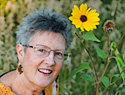 Colleen Crosson with sunflower